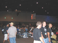 Fans try to find seats a few minutes before Star Wars Spectacular, at Comic-Con International 2004, begins.